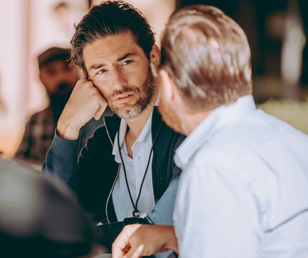 Coaching session with two business men